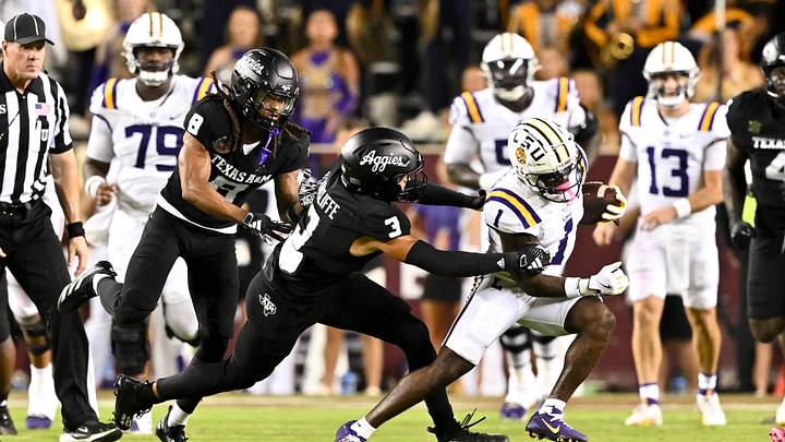 Oct 26, 2024; College Station, Texas, USA; LSU Tigers wide receiver Aaron Anderson (1) runs the ball as Texas A&M Aggies defensive back Marcus Ratcliffe (3) defends during the third quarter. The Aggies defeated the Tigers 38-23; at Kyle Field. Mandatory Credit: Maria Lysaker-Imagn Images. Oct 26, 2024; College Station, Texas, USA; LSU Tigers wide receiver Aaron Anderson (1) runs the ball as Texas A&M Aggies defensive back Marcus Ratcliffe (3) defends during the third quarter. The Aggies defeated the Tigers 38-23; at Kyle Field. Mandatory Credit: Maria Lysaker-Imagn Images.