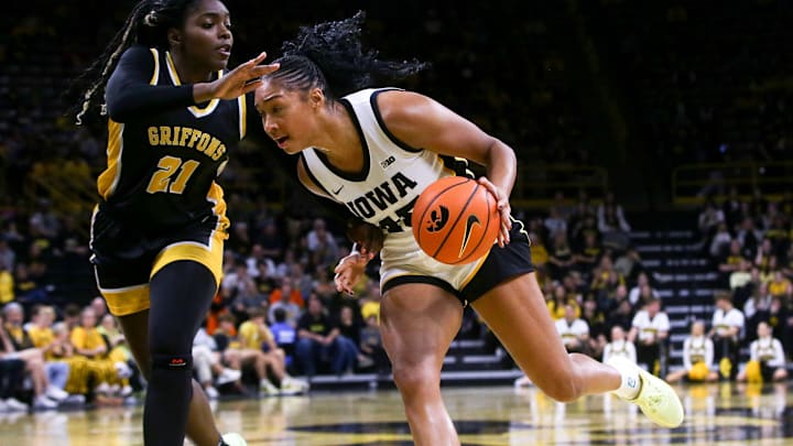 Iowa’s Hannah Stuelke (45) drives to the basket as Missouri Western’s Tiani Ellison (21) defends Wednesday, Oct. 30, 2024 at Carver-Hawkeye Arena in Iowa City, Iowa. Iowa’s Hannah Stuelke (45) drives to the basket as Missouri Western’s Tiani Ellison (21) defends Wednesday, Oct. 30, 2024 at Carver-Hawkeye Arena in Iowa City, Iowa.
