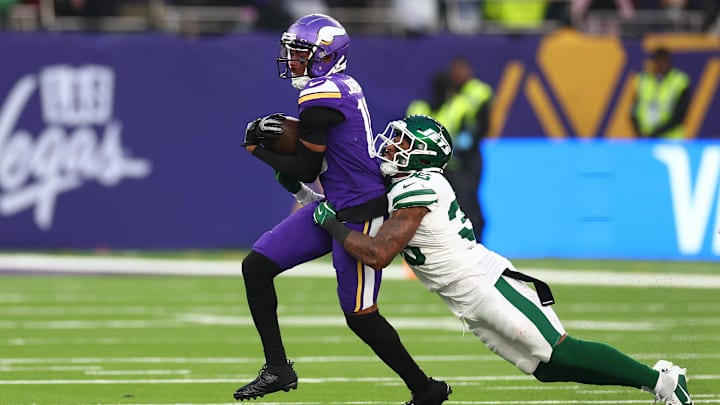 Oct 6, 2024; Tottenham, ENG; New York Jets defensive back Chuck Clark (36) tackles Minnesota Vikings Wide Receiver Justin Jefferson (18) in the 4th Quarter at Tottenham Hotspur Stadium. Oct 6, 2024; Tottenham, ENG; New York Jets defensive back Chuck Clark (36) tackles Minnesota Vikings Wide Receiver Justin Jefferson (18) in the 4th Quarter at Tottenham Hotspur Stadium.