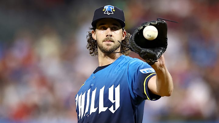 Aaron Nola gets ready for the next pitch against the New York Mets in their *very blue* uniforms.