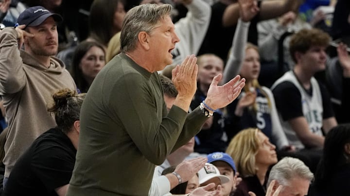 Minnesota Timberwolves head coach Chris Finch cheers on his team as they play the Phoenix Suns in the third quarter at Target Center in Minneapolis on March 28, 2025.