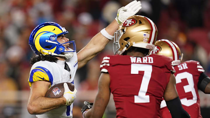 Dec 12, 2024; Santa Clara, California, USA; Los Angeles Rams wide receiver Puka Nacua (17) reacts after making a catch for a first down next to San Francisco 49ers cornerback Charvarius Ward (7) in the fourth quarter at Levi's Stadium. Mandatory Credit: Cary Edmondson-Imagn Images
