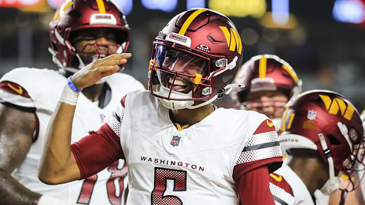 Sep 23, 2024; Cincinnati, Ohio, USA; Washington Commanders quarterback Jayden Daniels (5) reacts after scoring a touchdown against the Cincinnati Bengals in the first half at Paycor Stadium. Mandatory Credit: Katie Stratman-Imagn Images Sep 23, 2024; Cincinnati, Ohio, USA; Washington Commanders quarterback Jayden Daniels (5) reacts after scoring a touchdown against the Cincinnati Bengals in the first half at Paycor Stadium. Mandatory Credit: Katie Stratman-Imagn Images