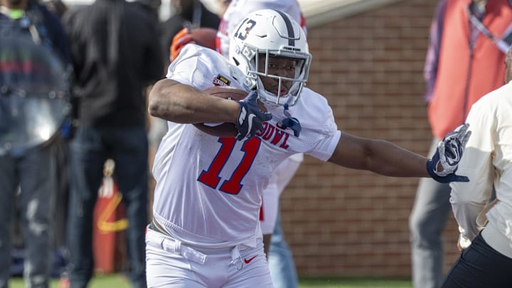 Jan 29, 2026; Mobile, AL, USA; National running back Kaytron Allen (11) of Penn State runs the ball during National Senior Bowl practice at Hancock Whitney Stadium. Mandatory Credit: Vasha Hunt-Imagn Images