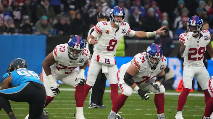 Nov 10, 2024; Munich, Germany; New York Giants quarterback Daniel Jones (8) prepares to take the snap against the Carolina Panthers in the first half during the 2024 NFL Munich Game at Allianz Arena. Mandatory Credit: Kirby Lee-Imagn Images Nov 10, 2024; Munich, Germany; New York Giants quarterback Daniel Jones (8) prepares to take the snap against the Carolina Panthers in the first half during the 2024 NFL Munich Game at Allianz Arena. Mandatory Credit: Kirby Lee-Imagn Images