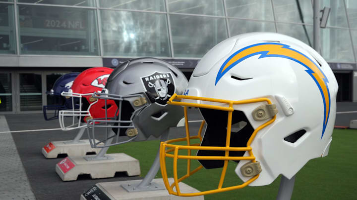 Oct 13, 2024; London, United Kingdom; Large helmets of the Los Angeles Chargers, Las Vegas Raiders, Kansas City Chiefs and Denver Broncos of the AFC West before an NFL International Series game at Tottenham Hotspur Stadium. Mandatory Credit: Kirby Lee-Imagn Images Oct 13, 2024; London, United Kingdom; Large helmets of the Los Angeles Chargers, Las Vegas Raiders, Kansas City Chiefs and Denver Broncos of the AFC West before an NFL International Series game at Tottenham Hotspur Stadium. Mandatory Credit: Kirby Lee-Imagn Images