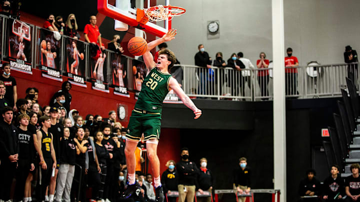 Iowa City West's Pete Moe dunks the ball during a Class 4A varsity boys' basketball game against Iowa City High, Friday, Dec. 17, 2021, at City High Arena in Iowa City, Iowa.
211217 Ic West City B 014 Jpg Iowa City West's Pete Moe dunks the ball during a Class 4A varsity boys' basketball game against Iowa City High, Friday, Dec. 17, 2021, at City High Arena in Iowa City, Iowa.
211217 Ic West City B 014 Jpg