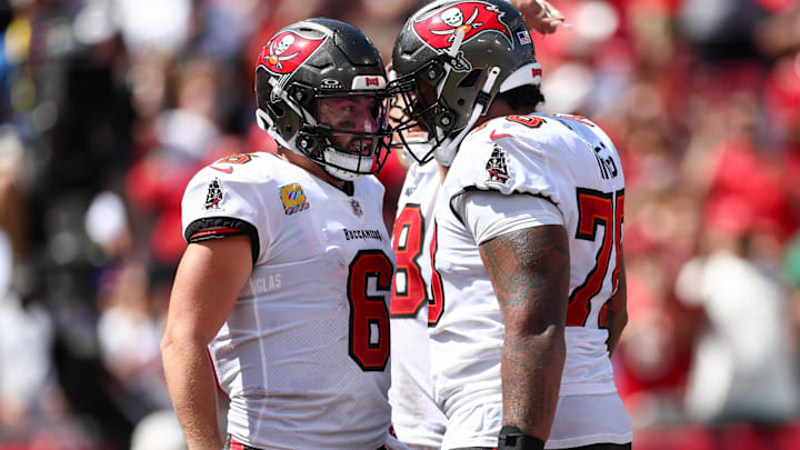 Sep 29, 2024; Tampa, Florida, USA; Tampa Bay Buccaneers offensive tackle Tristan Wirfs (78) congratulates quarterback Baker Mayfield (6) after a touchdown against the Philadelphia Eagles in the second quarter at Raymond James Stadium. Mandatory Credit: Nathan Ray Seebeck-Imagn Images