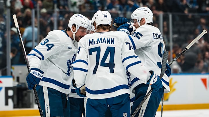 Jan 31, 2026; Vancouver, British Columbia, CAN; Toronto Maple Leafs forward Auston Matthews (34) and  defenseman Troy Stecher (28) and forward Max Domi (11) and defenseman Oliver Ekman-Larsson (95) and forward Bobby McMann (74) celebrate Domi’s goal against the Vancouver Canucks in the third period at Rogers Arena. Mandatory Credit: Bob Frid-Imagn Images