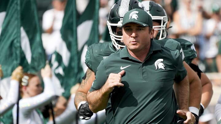 Sep 13, 2025; East Lansing, Michigan, USA; Michigan State head coach Jonathan Smith takes the field before a game against Youngstown State at Spartan Stadium. Mandatory Credit: Brendan Mullin-Imagn Images