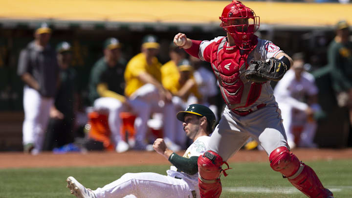 Aug 10, 2022; Oakland, California, USA; Los Angeles Angels designated hitter Max Stassi (33) throws