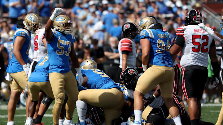 Oct 8, 2022; Pasadena, California, USA; UCLA Bruins linebacker Darius Muasau (53) reacts after stopping Utah Utes third down run during the first quarter at Rose Bowl. Mandatory Credit: Kiyoshi Mio-Imagn Images Oct 8, 2022; Pasadena, California, USA; UCLA Bruins linebacker Darius Muasau (53) reacts after stopping Utah Utes third down run during the first quarter at Rose Bowl. Mandatory Credit: Kiyoshi Mio-Imagn Images