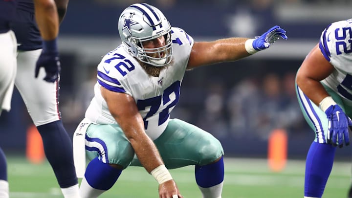 Dallas Cowboys center Travis Frederick signals prior to a snap in the first half against the Houston Texans.