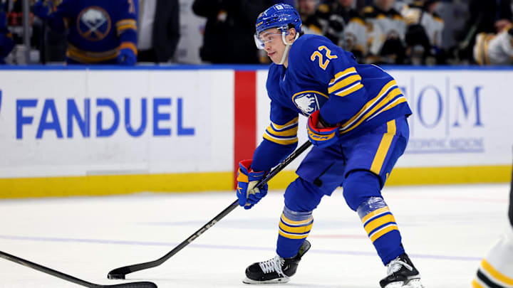 Jan 28, 2025; Buffalo, New York, USA;  Buffalo Sabres right wing Jack Quinn (22) looks to take a shot on goal during the second period against the Boston Bruins at KeyBank Center. Mandatory Credit: Timothy T. Ludwig-Imagn Images