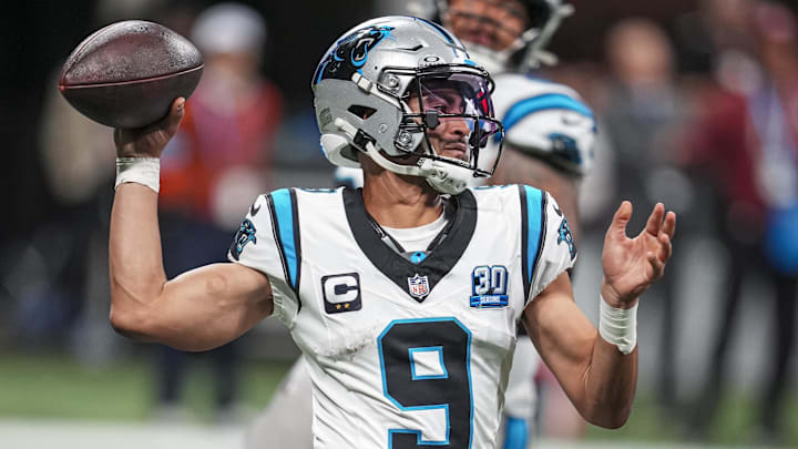 Carolina Panthers quarterback Bryce Young passes on the run against the Atlanta Falcons.
