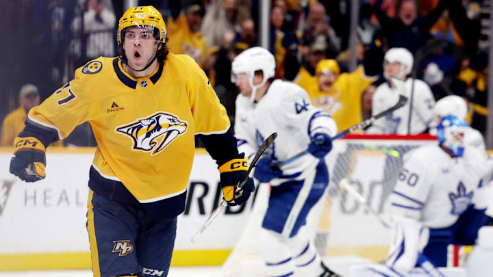 Mar 22, 2025; Nashville, Tennessee, USA; Nashville Predators right wing Luke Evangelista (77) celebrates after scoring a goal during the third period of their game against the Toronto Maple Leafs at Bridgestone Arena. Mandatory Credit: Alan Poizner-Imagn Images