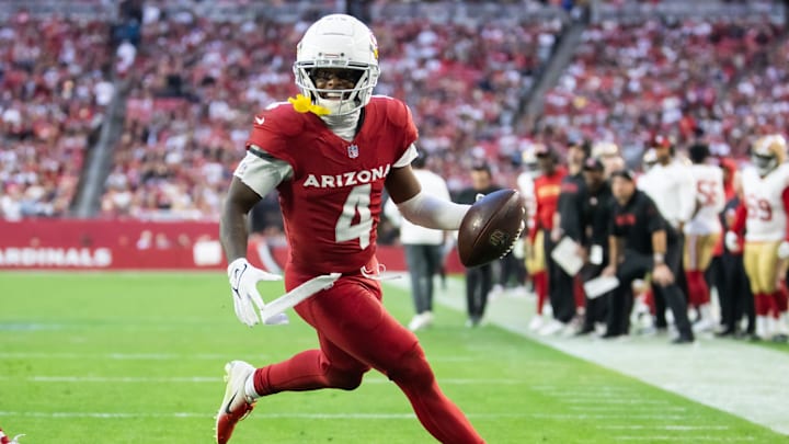 Jan 5, 2025; Glendale, Arizona, USA; Arizona Cardinals wide receiver Greg Dortch (4) scores a touchdown against the San Francisco 49ers in the second half at State Farm Stadium. Mandatory Credit: Mark J. Rebilas-Imagn Images Jan 5, 2025; Glendale, Arizona, USA; Arizona Cardinals wide receiver Greg Dortch (4) scores a touchdown against the San Francisco 49ers in the second half at State Farm Stadium. Mandatory Credit: Mark J. Rebilas-Imagn Images
