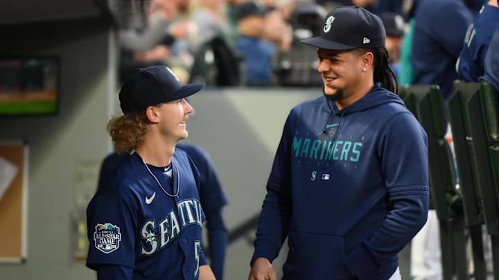 May 24, 2023; Seattle, Washington, USA; Seattle Mariners starting pitcher Bryce Miller (50) and pitcher Luis Castillo (58) interact during the sixth inning against the Oakland Athletics at T-Mobile Park. Mandatory Credit: Steven Bisig-Imagn Images
