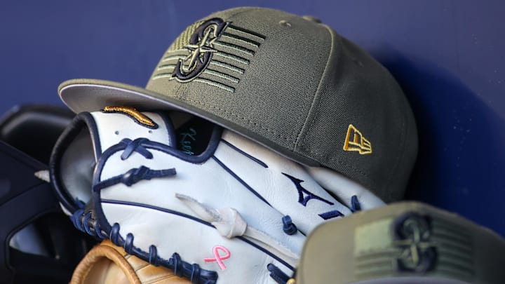 A Seattle Mariners Armed Forces Day hat is pictured in the dugout before a game against the Atlanta Braves on May 20, 2023, at Truist Park.