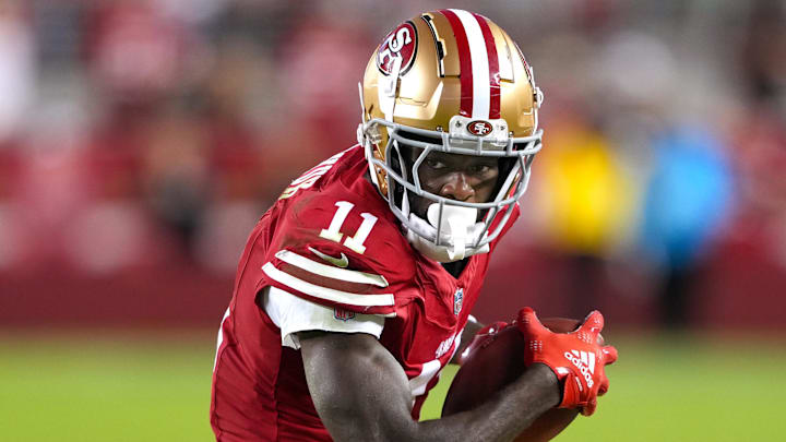 Sep 9, 2024; Santa Clara, California, USA; San Francisco 49ers wide receiver Brandon Aiyuk (11) runs after a catch against the New York Jets during the fourth quarter at Levi's Stadium. Mandatory Credit: Darren Yamashita-Imagn Images