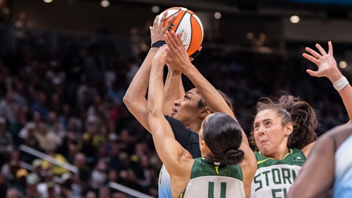 Aug 27, 2025; Seattle, Washington, USA; Chicago Sky forward Angel Reese (5) goes up for a shot against Seattle Storm guard Skylar Diggins (4) and forward Mackenzie Holmes (54) during the second half  at T-Mobile Park. Mandatory Credit: Stephen Brashear-Imagn Images