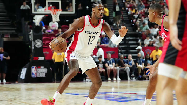 Jul 14, 2024; Las Vegas, NV, USA; Washington Wizards forward Alex Sarr (12) dribbles against the Houston Rockets during the first quarter at Thomas & Mack Center. Mandatory Credit: Stephen R. Sylvanie-Imagn Images