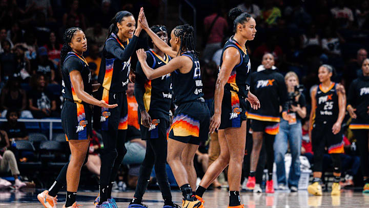 Jul 27, 2025; Washington, District of Columbia, USA; Phoenix Mercury players celebrate after the game against the Washington Mystics at CareFirst Arena. Mandatory Credit: Emily Faith Morgan-Imagn Images