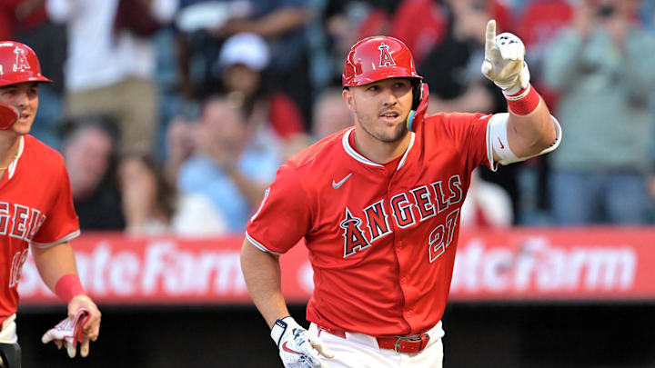 Apr 9, 2024; Anaheim, California, USA;  Los Angeles Angels outfielder Mike Trout (27) crosses the plate after hitting a two run home run in the first inning against the Tampa Bay Rays at Angel Stadium. Mandatory Credit: Jayne Kamin-Oncea-Imagn Images
