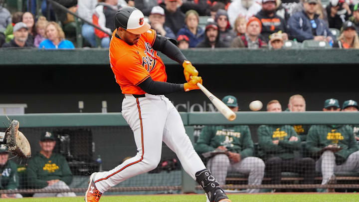 Apr 27, 2024; Baltimore, Maryland, USA; Baltimore Orioles right fielder Anthony Santander (25) hits a RBI double against the Oakland Athletics during the fourth inning at Oriole Park at Camden Yards. Apr 27, 2024; Baltimore, Maryland, USA; Baltimore Orioles right fielder Anthony Santander (25) hits a RBI double against the Oakland Athletics during the fourth inning at Oriole Park at Camden Yards.