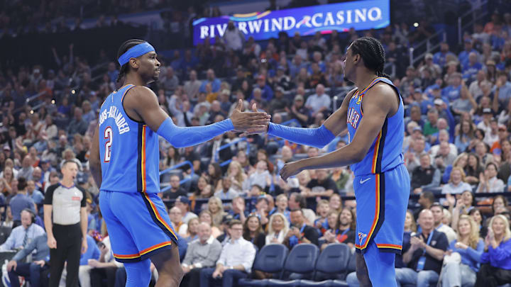 Apr 2, 2025; Oklahoma City, Oklahoma, USA; Oklahoma City Thunder guard Shai Gilgeous-Alexander (2) and forward Jalen Williams (8) high-five after a play against the Detroit Pistons during the first quarter at Paycom Center. Mandatory Credit: Alonzo Adams-Imagn Images