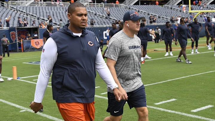 Aug 26, 2023; Chicago, Illinois, USA;  Chicago Bears General Manager Ryan Poles, left, and Luke Getsy, Offensive Coordinator walk the field  before the team s game against the Buffalo Bills at Soldier Field. Mandatory Credit: Matt Marton-Imagn Images