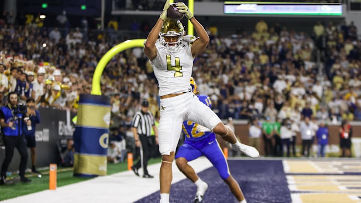 Nov 22, 2025; Atlanta, Georgia, USA; Georgia Tech Yellow Jackets wide receiver Isiah Canion (4) catches a touchdown pass against the Pittsburgh Panthers in the fourth quarter at Bobby Dodd Stadium at Hyundai Field. Mandatory Credit: Brett Davis-Imagn Images