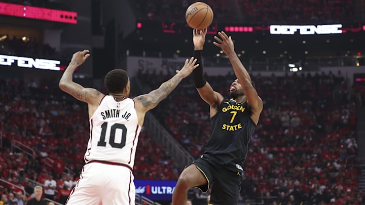 May 4, 2025; Houston, Texas, USA; Golden State Warriors guard Buddy Hield (7) shoots the ball over Houston Rockets forward Jabari Smith Jr. (10) during game seven of the first round for the 2025 NBA Playoffs at Toyota Center. Mandatory Credit: Troy Taormina-Imagn Images
