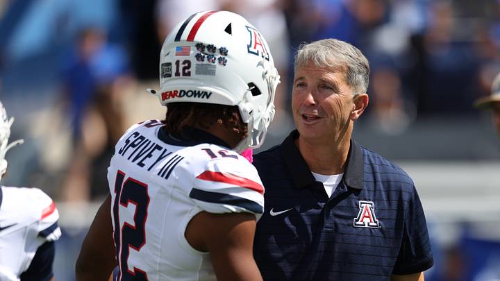 Sep 12, 2026; Provo, Utah, USA; Arizona Wildcats wide receiver Tre Spivey (12) and head coach Brent Brennan talk prior to the game against the BYU Cougars at LaVell Edwards Stadium. Sep 12, 2026; Provo, Utah, USA; Arizona Wildcats wide receiver Tre Spivey (12) and head coach Brent Brennan talk prior to the game against the BYU Cougars at LaVell Edwards Stadium.