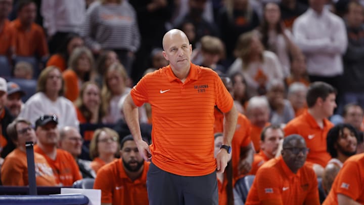 Dec 13, 2025; Oklahoma City, Oklahoma, USA; Oklahoma State Cowboys head coach Steve Lutz watches his team play against the Oklahoma Sooners during the second half at Paycom Center. Mandatory Credit: Alonzo Adams-Imagn Images Dec 13, 2025; Oklahoma City, Oklahoma, USA; Oklahoma State Cowboys head coach Steve Lutz watches his team play against the Oklahoma Sooners during the second half at Paycom Center. Mandatory Credit: Alonzo Adams-Imagn Images