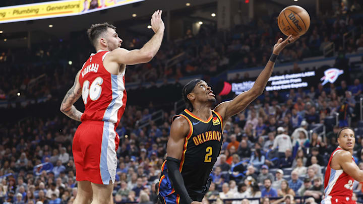 Dec 29, 2024; Oklahoma City, Oklahoma, USA; Oklahoma City Thunder guard Shai Gilgeous-Alexander (2) shoots in front of Memphis Grizzlies guard John Konchar (46) during the second quarter at Paycom Center. Mandatory Credit: Alonzo Adams-Imagn Images