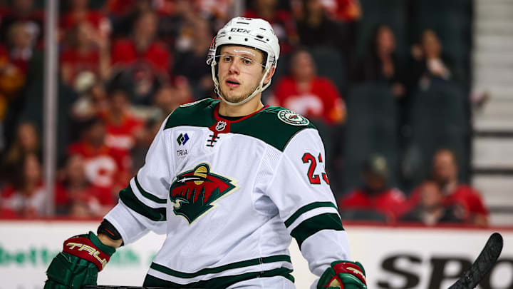 Apr 11, 2025; Calgary, Alberta, CAN; Minnesota Wild center Marco Rossi (23) against the Calgary Flames during the third period at Scotiabank Saddledome. Mandatory Credit: Sergei Belski-Imagn Images