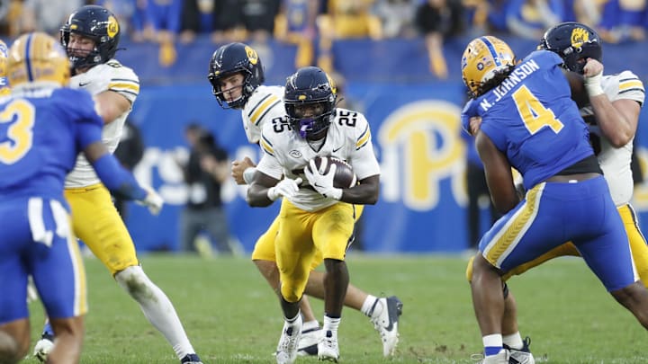 Oct 12, 2024; Pittsburgh, Pennsylvania, USA;  California Golden Bears running back Jaivian Thomas (25) runs the ball against the Pittsburgh Panthers during the fourth quarter at Acrisure Stadium. Pittsburgh won 17-15. Mandatory Credit: Charles LeClaire-Imagn Images