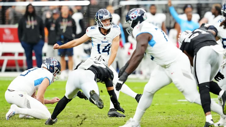 Oct 12, 2025; Paradise, Nevada, USA; Tennessee Titans Matthew Wright (14) punts the ball during the second half against the Las Vegas Raiders at Allegiant Stadium. Mandatory Credit: Stephen R. Sylvanie-Imagn Images