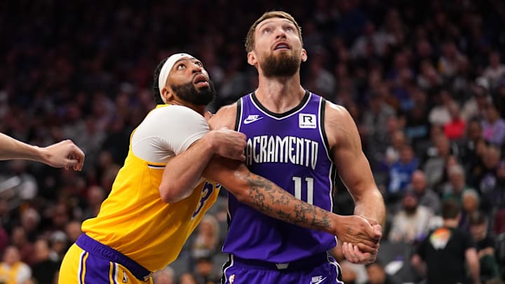 Dec 19, 2024; Sacramento, California, USA; Los Angeles Lakers forward Anthony Davis (3) battles for position with Sacramento Kings center Domantas Sabonis (11) in the first quarter at the Golden 1 Center. Mandatory Credit: Cary Edmondson-Imagn Images