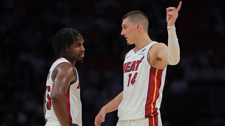 Apr 26, 2025; Miami, Florida, USA; Miami Heat guard Davion Mitchell (45) and Miami Heat guard Tyler Herro (14) talk against the Cleveland Cavaliers in the first quarter during game three for the first round of the 2025 NBA Playoffs at Kaseya Center. Mandatory Credit: Sam Navarro-Imagn Images Apr 26, 2025; Miami, Florida, USA; Miami Heat guard Davion Mitchell (45) and Miami Heat guard Tyler Herro (14) talk against the Cleveland Cavaliers in the first quarter during game three for the first round of the 2025 NBA Playoffs at Kaseya Center. Mandatory Credit: Sam Navarro-Imagn Images