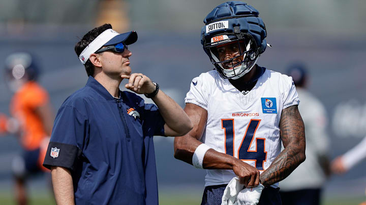 Jul 24, 2025; Englewood, CO, USA; Denver Broncos wide receiver Courtland Sutton (14) and passing game specialist Zack Grossi during Denver Broncos Training Camp. Mandatory Credit: Isaiah J. Downing-Imagn Images