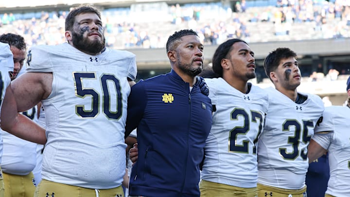 Oct 26, 2024; East Rutherford, New Jersey, USA; Notre Dame Fighting Irish head coach Marcus Freeman sings the Notre Dame alma mater with teammates after the game against the Navy Midshipmen at MetLife Stadium. Oct 26, 2024; East Rutherford, New Jersey, USA; Notre Dame Fighting Irish head coach Marcus Freeman sings the Notre Dame alma mater with teammates after the game against the Navy Midshipmen at MetLife Stadium.