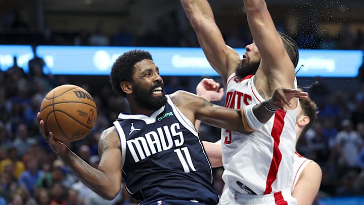 Oct 31, 2024; Dallas, Texas, USA;  Dallas Mavericks guard Kyrie Irving (11) looks to pass as Houston Rockets forward Dillon Brooks (9) defends during the second half at American Airlines Center. Mandatory Credit: Kevin Jairaj-Imagn Images