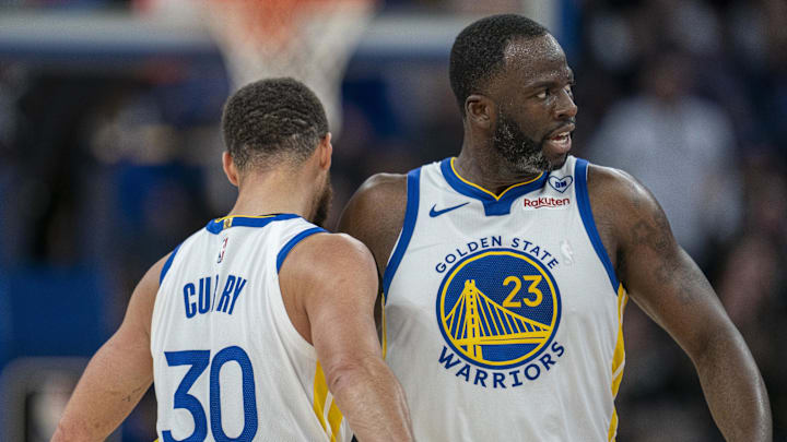 Golden State Warriors guard Stephen Curry (30) and forward Draymond Green (23) celebrate after the three point basket against the Philadelphia 76ers during the third quarter at Chase Center. Mandatory Credit: Neville E. Guard-Imagn Images