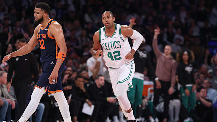 May 12, 2025; New York, New York, USA; Boston Celtics center Al Horford (42) runs up court after making a three point basket in the first half during game four of the second round for the 2025 NBA Playoffs as New York Knicks center Karl-Anthony Towns (32) reacts at Madison Square Garden. Mandatory Credit: Vincent Carchietta-Imagn Images