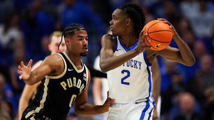 Oct 24, 2025; Lexington, KY, USA; Kentucky Wildcats guard Jasper Johnson (2) handles the ball guarded by Purdue Boilermakers guard C.J. Cox (0) during the first half at Rupp Arena at Central Bank Center. Mandatory Credit: Jordan Prather-Imagn Images Oct 24, 2025; Lexington, KY, USA; Kentucky Wildcats guard Jasper Johnson (2) handles the ball guarded by Purdue Boilermakers guard C.J. Cox (0) during the first half at Rupp Arena at Central Bank Center. Mandatory Credit: Jordan Prather-Imagn Images