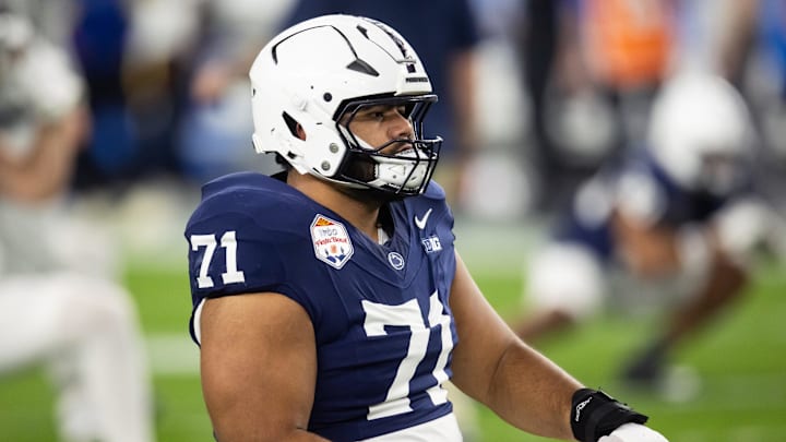 Dec 31, 2024; Glendale, AZ, USA; Penn State Nittany Lions offensive lineman Olaivavega Ioane (71) against the Boise State Broncos during the Fiesta Bowl at State Farm Stadium. Mandatory Credit: Mark J. Rebilas-Imagn Images