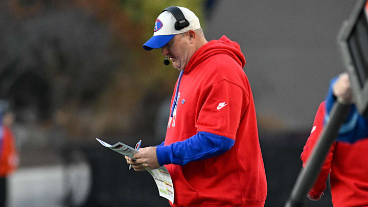 Dec 1, 2024; Foxborough, Massachusetts, USA; New England Patriots offensive coordinator Alex Van Pelt reviews the play card during the second half against the Indianapolis Colts at Gillette Stadium. Mandatory Credit: Eric Canha-Imagn Images