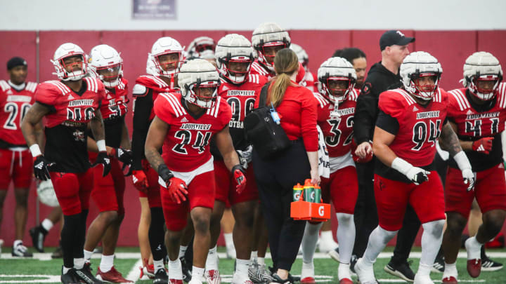The Louisville defense takes to the field during practice on April 12, 2024 before the Red-White scrimmage game. The Louisville defense takes to the field during practice on April 12, 2024 before the Red-White scrimmage game.